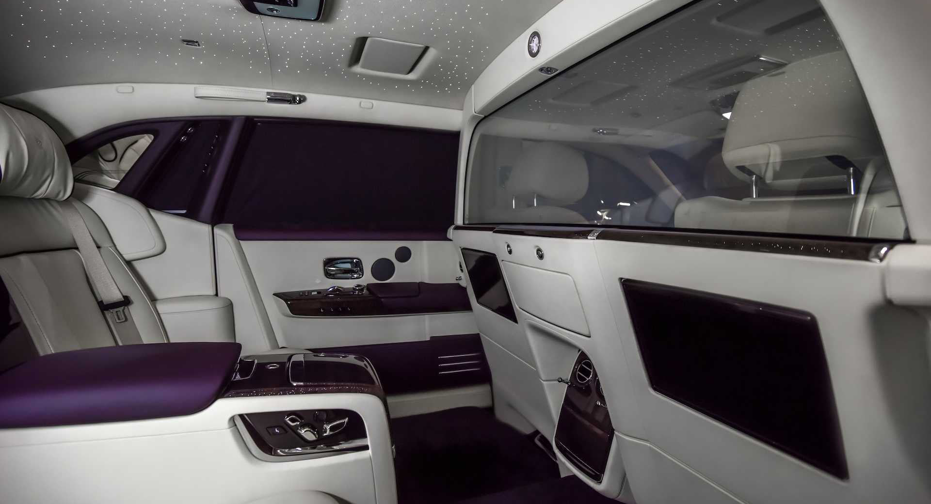 This Rolls Royce Phantom Has A Purple And White Interior